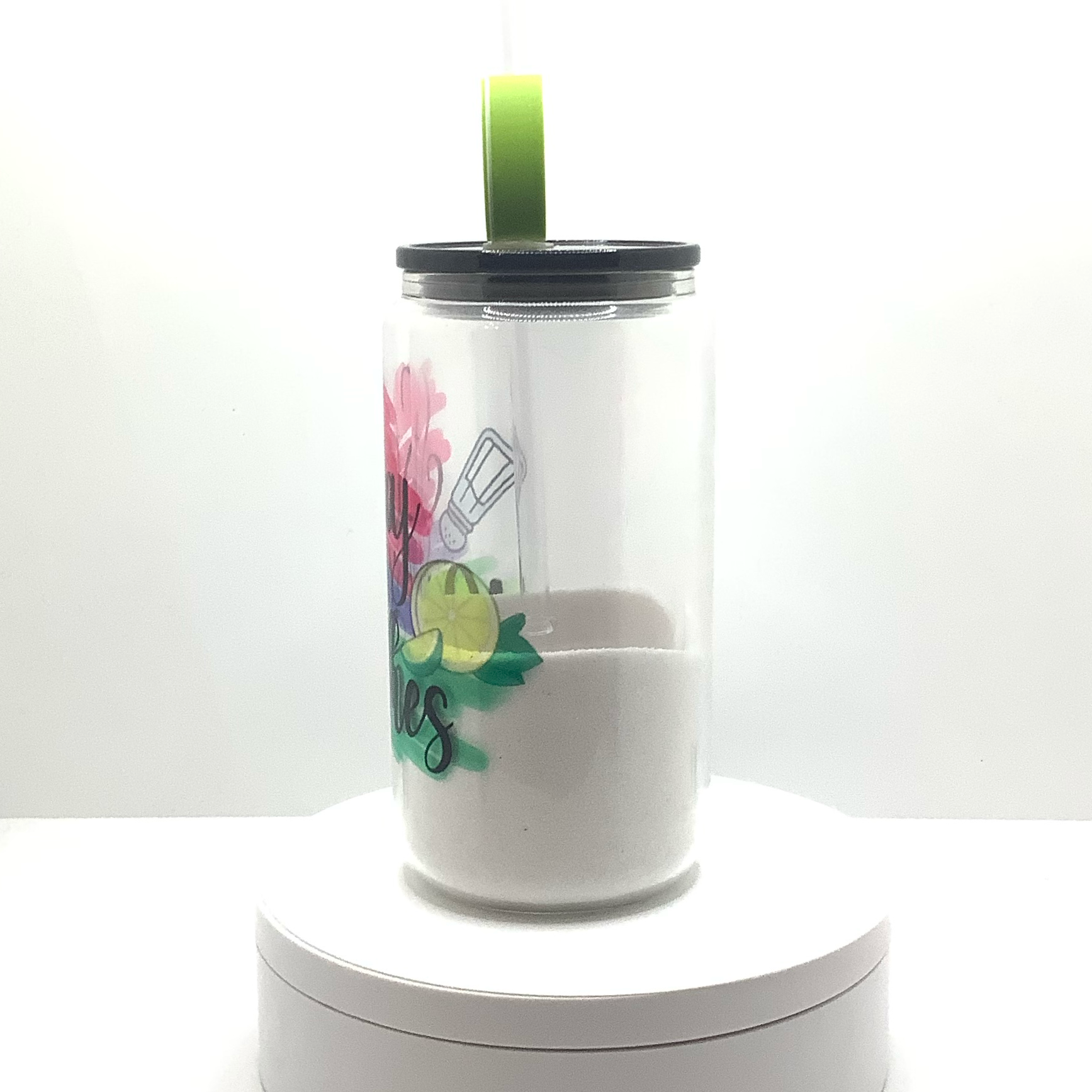 16oz clear snow globe glass can with colorful text, salt shaker and lemon/lime graphic.  Filled with "salt". Black acrylic lid and lime wedge straw topper. 