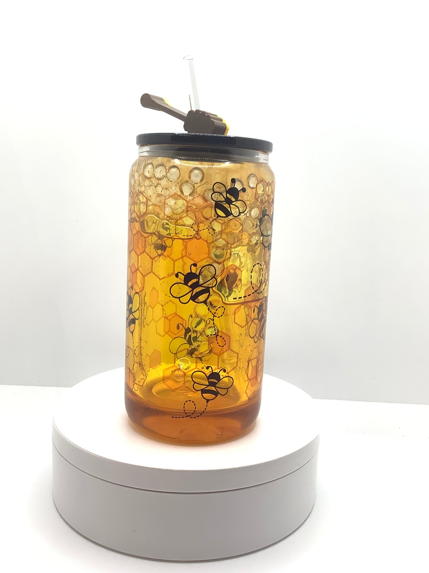 Bee-themed glass cup with honey design.