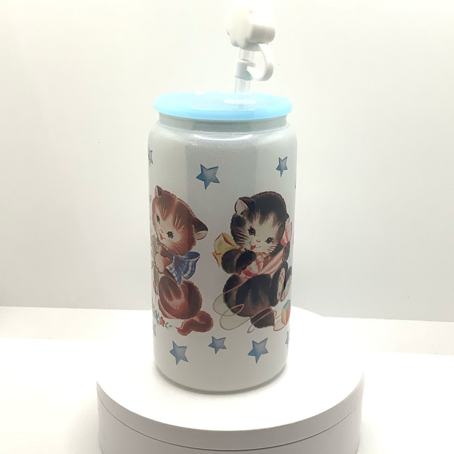 White shimmery glass can with vintage cat illustrations 